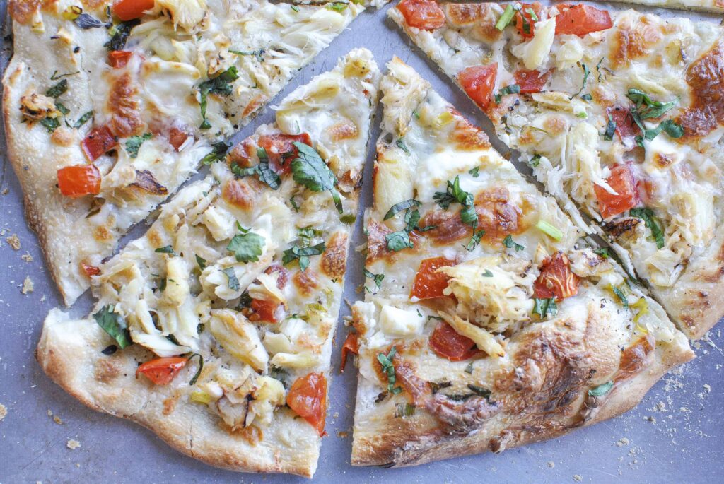 crab pizza recipe cut into slices