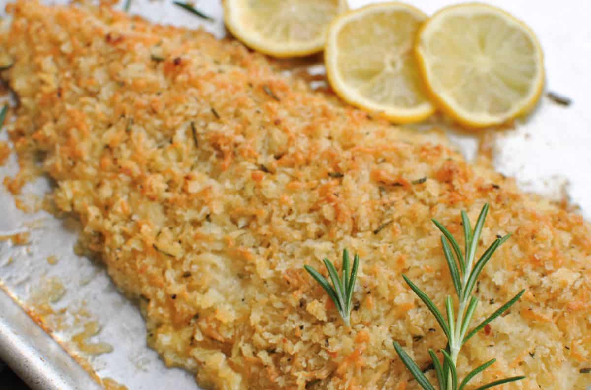 parm crusted fish with garlic lemon and rosemary on a sheet pan fresh out the oven