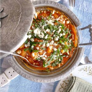 gnocchi roasted red pepper soup basil and feta in antique serving bowl