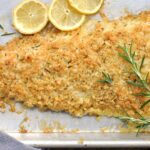 rosemary parmesan crusted fish with fresh rosemary and lemon slices