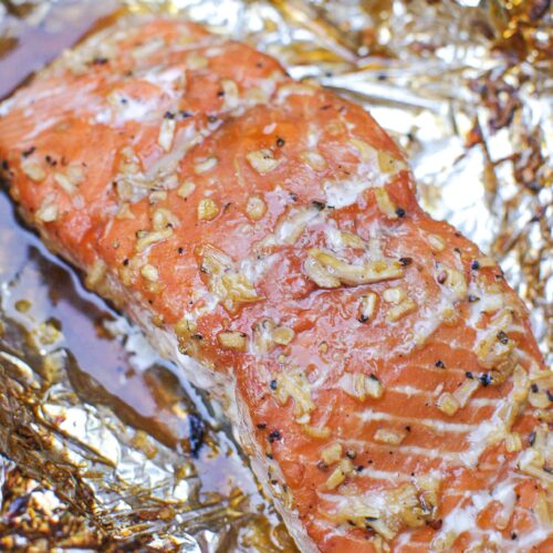 salmon fillet on foil with bourbon brown sugar and chopped onion glaze