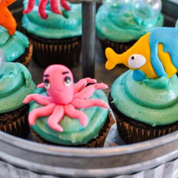 tahini frosting with chocolate cupcakes and cupcake toppers under the sea themed party
