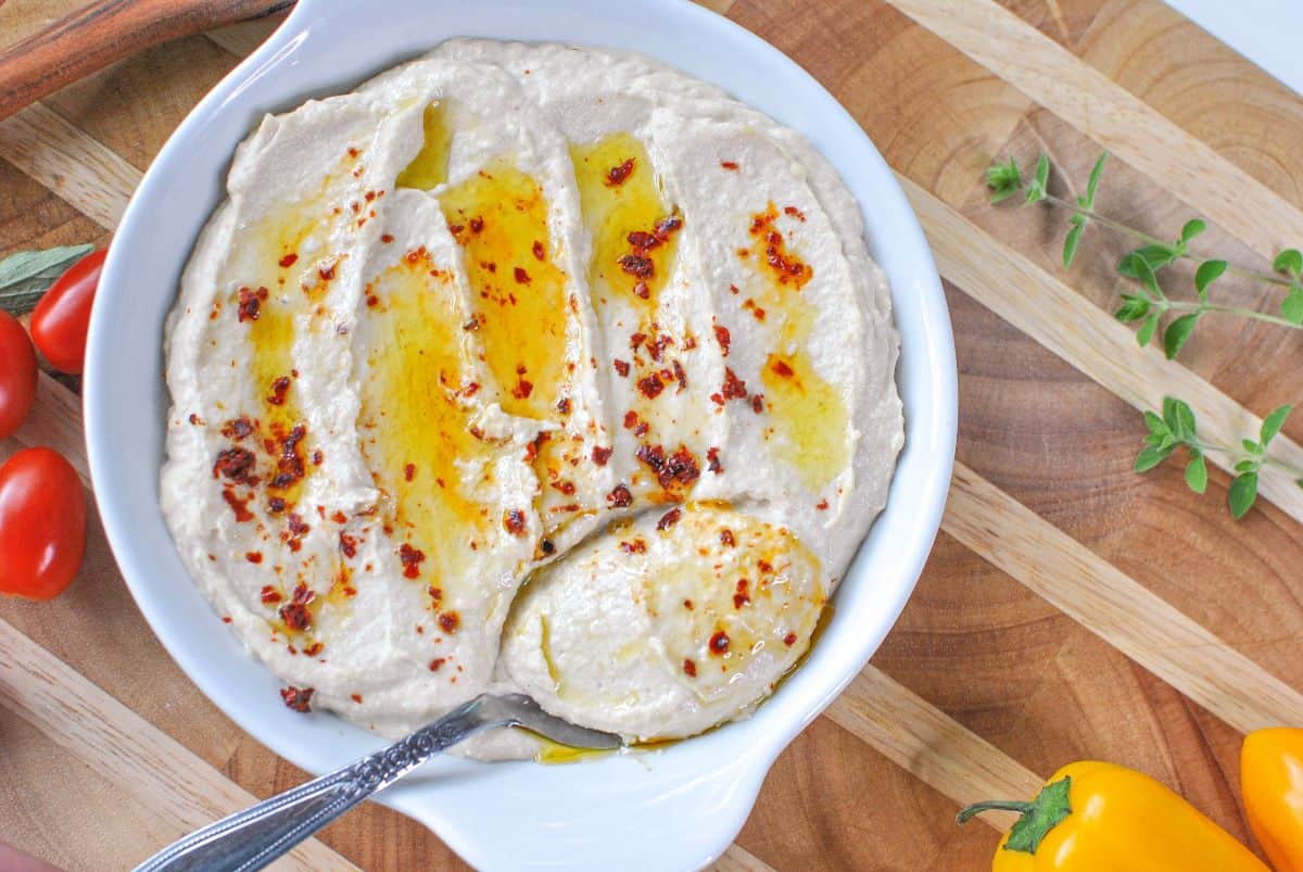 hummus on platter with tomatoes dished 