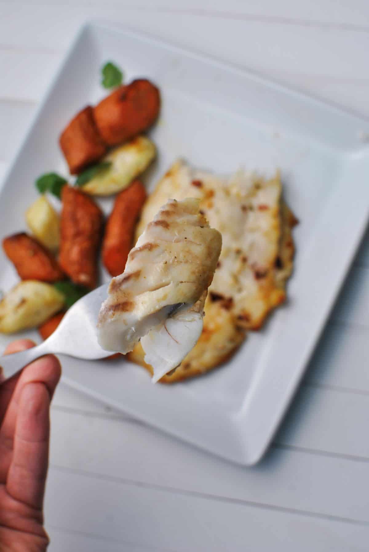 a bite of cooked frozen fish fillets in the air fryer