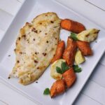 fish fillet cooked in air fryer with roasted air fries carrots and parsnips