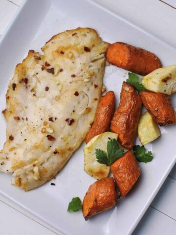 fish fillet cooked in air fryer with roasted air fries carrots and parsnips