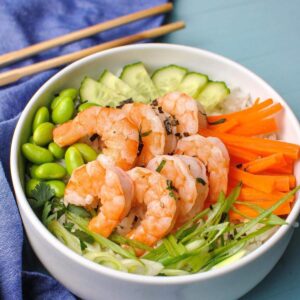Shrimp Poke Bowl with carrots, green onion, cucumber and edamame