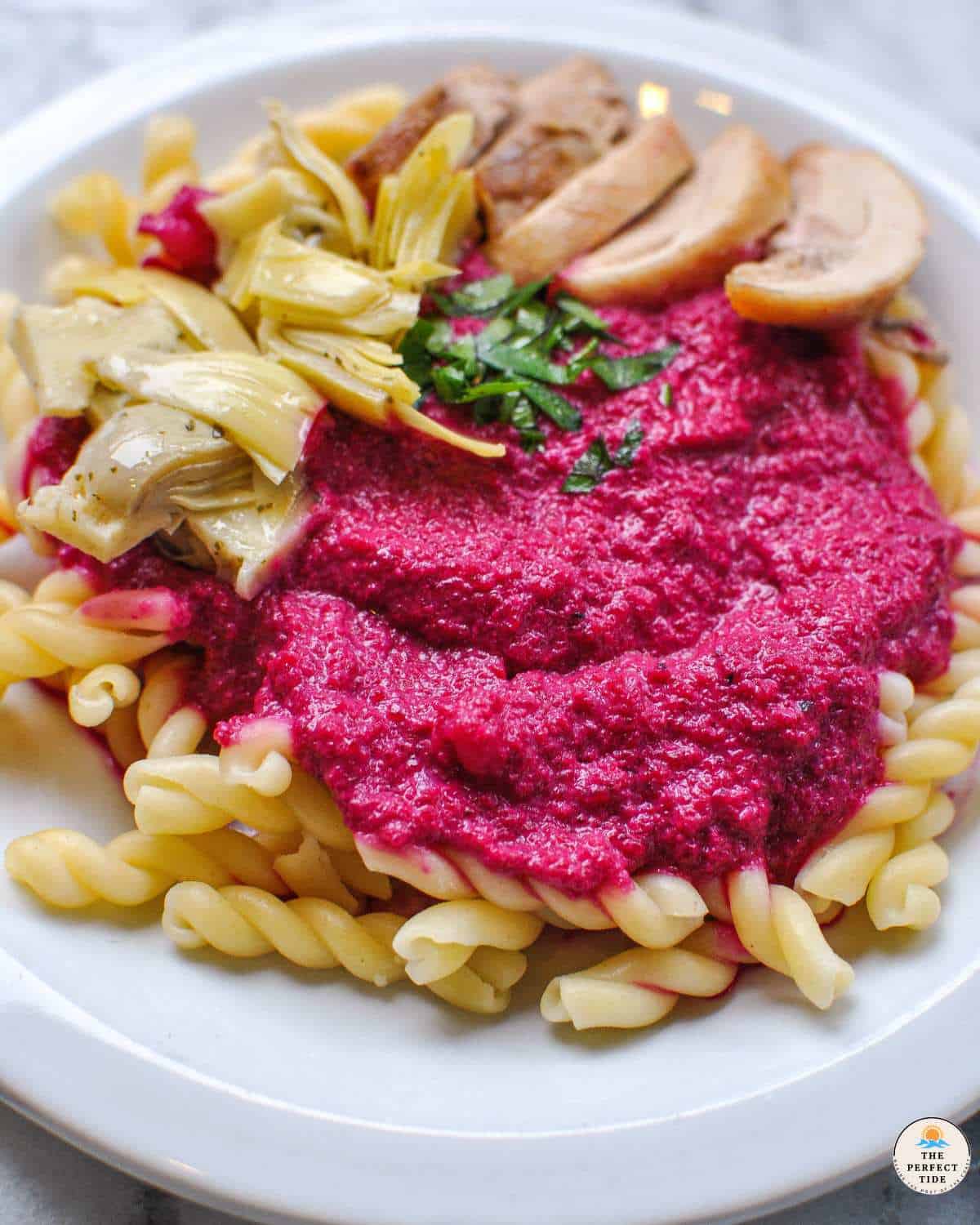 beet pasta with artichokes parsley and chicken