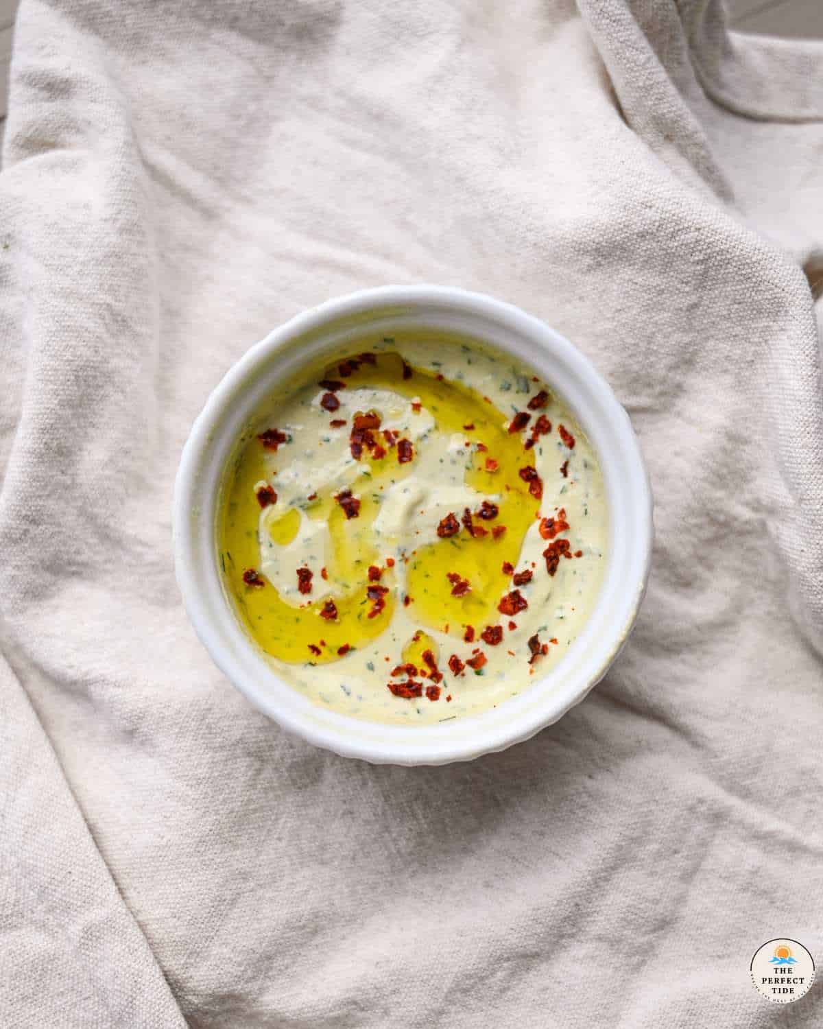 lemon herb tahini sauce with olive oil and aleppo pepper