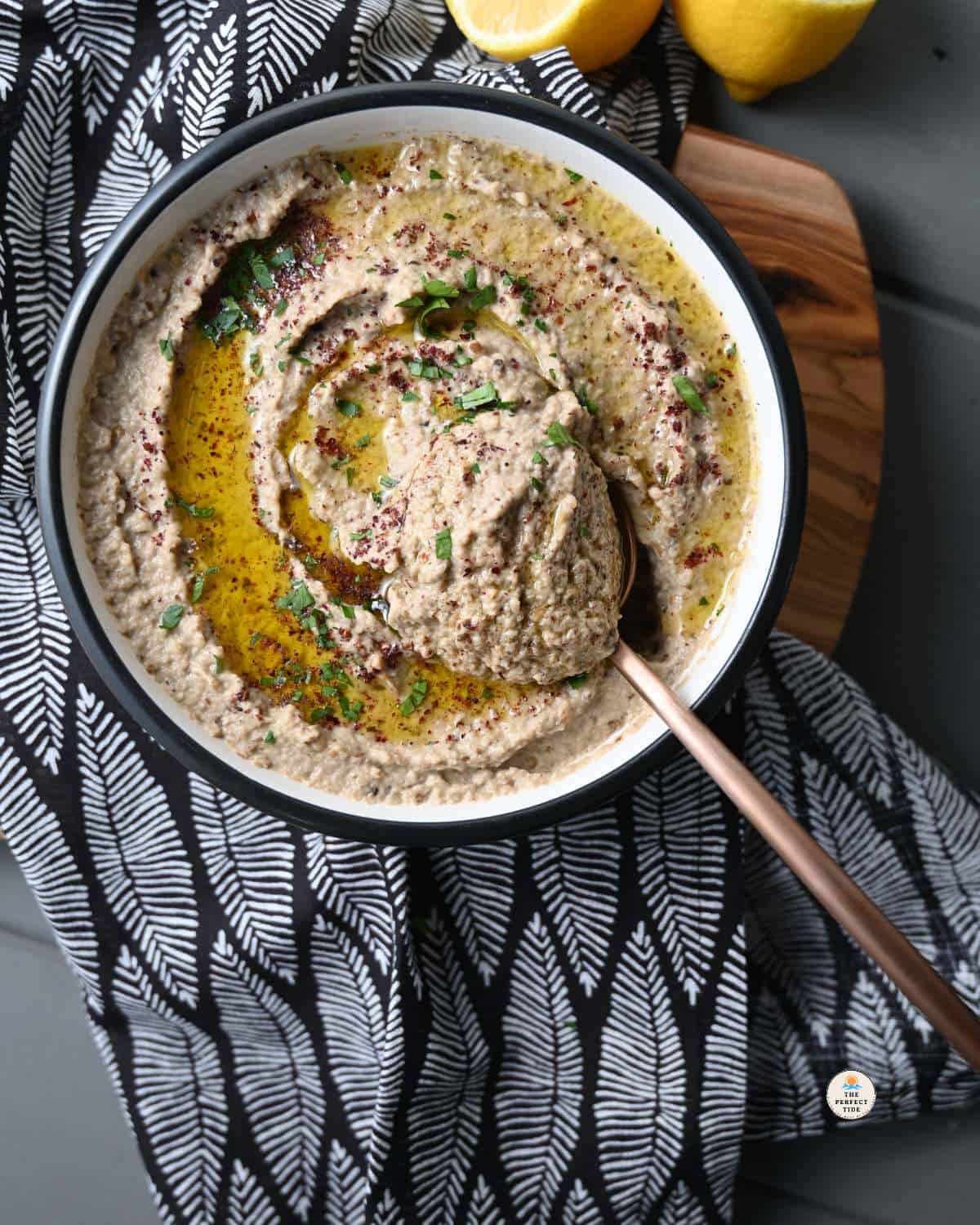 baba ghanouj plated with olive oil sumac and parsley