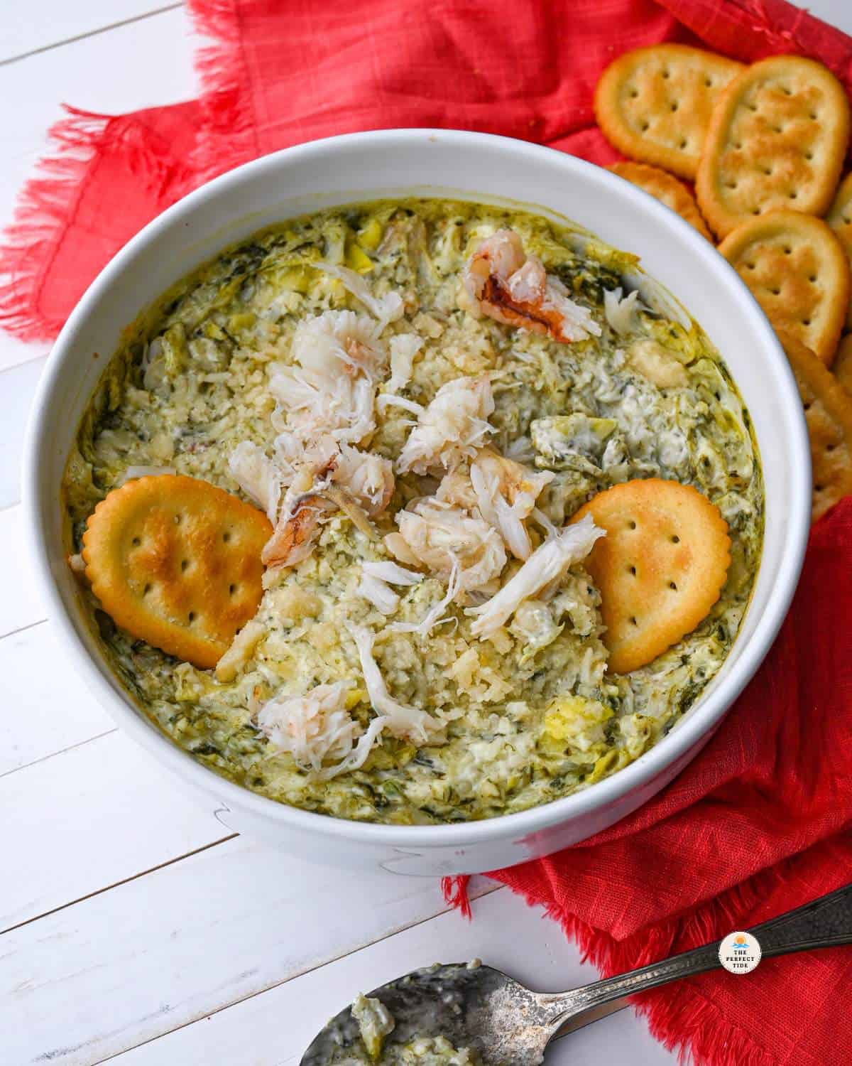 hot crab dip with spinach and artichoke and crackers