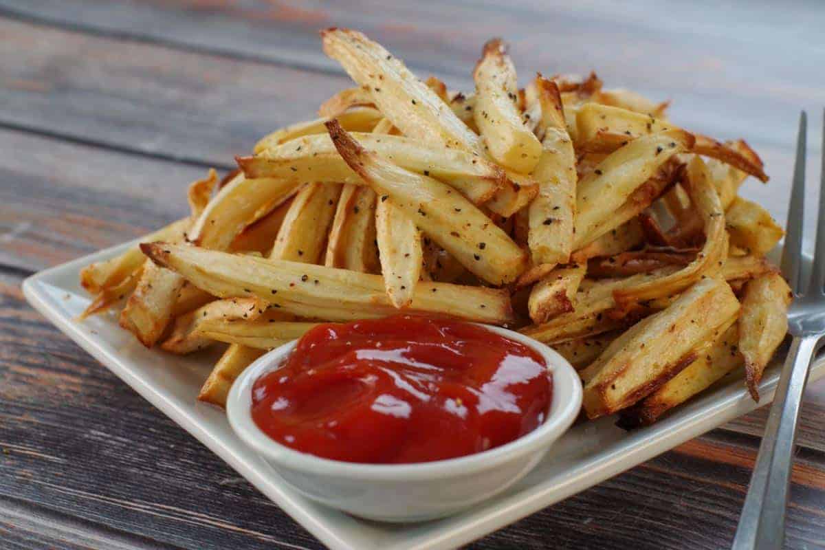 plated lemon pepper parsnip fries with a side of ketchup
