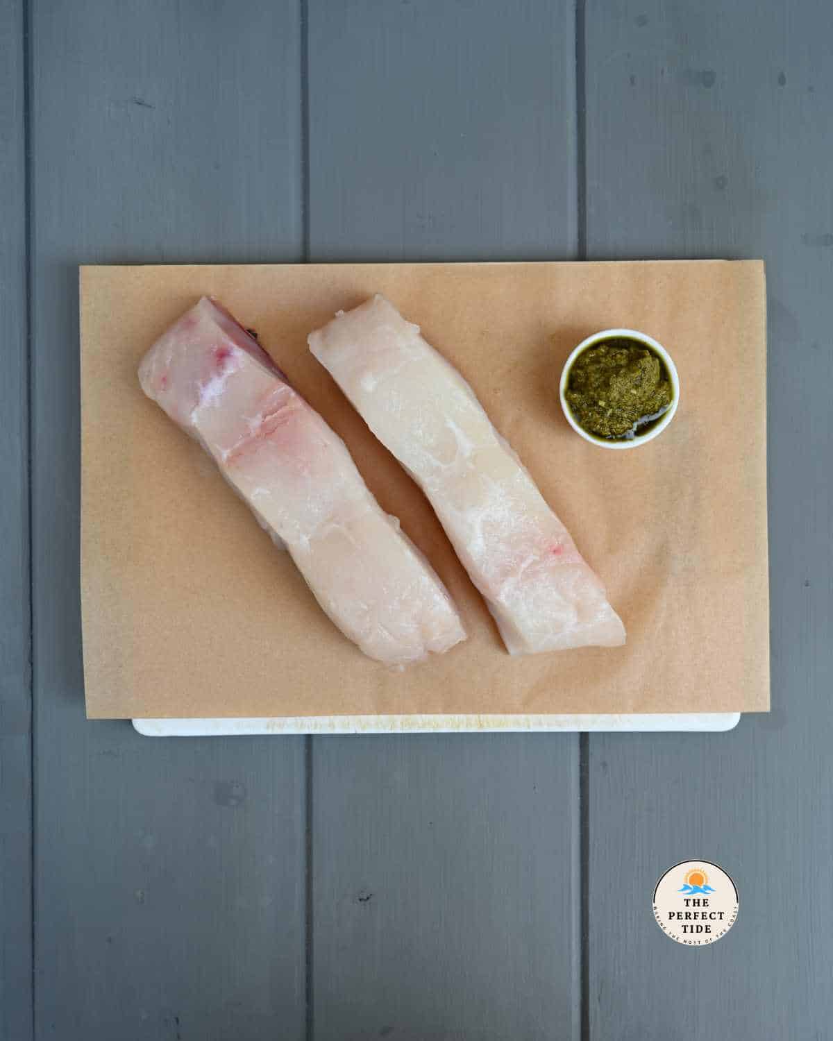 fresh halibut filets and a small jar of pesto | air fryer halibut with pesto ingredients 