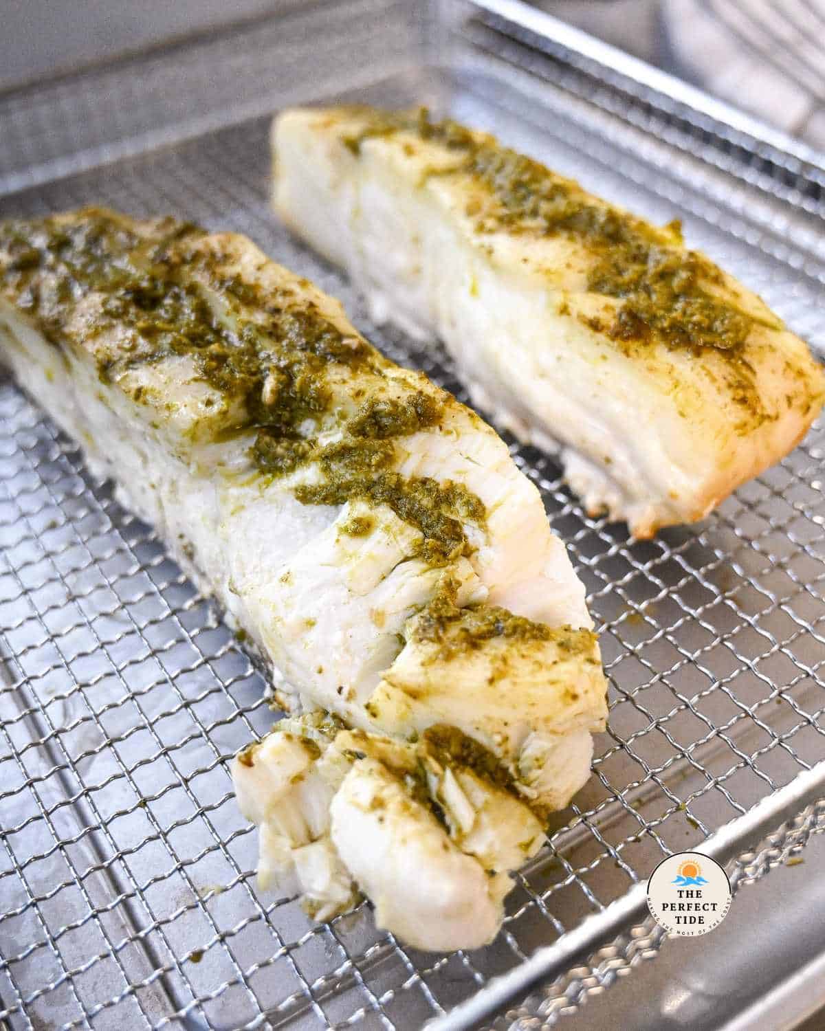 flaked air fryer halibut with pesto sauce