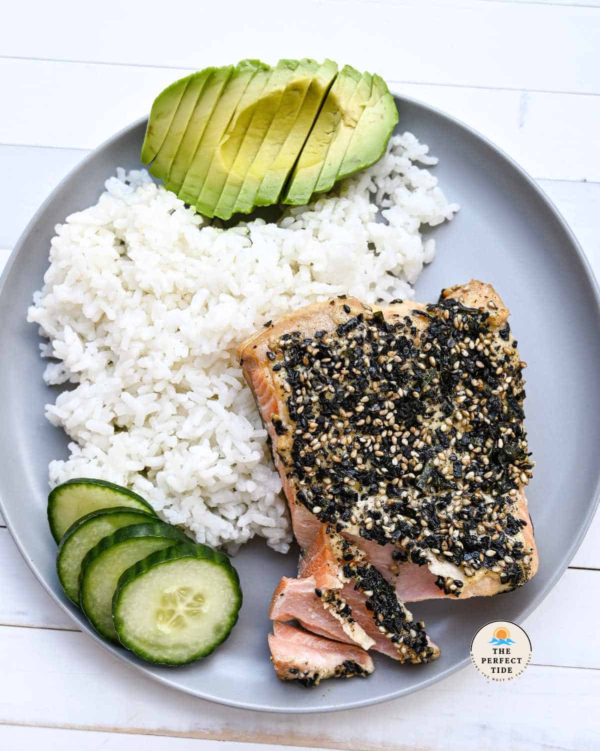 furikake salmon recipe with a side of rice cucumber and avocado