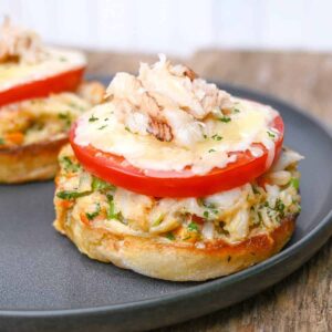 crab melts on english muffins with tomato and cheese