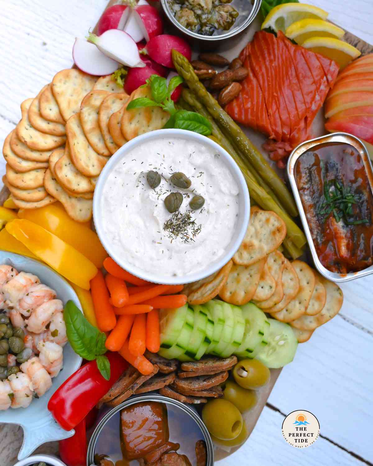 seacuterie board with various seafood tinned fish and shrimp