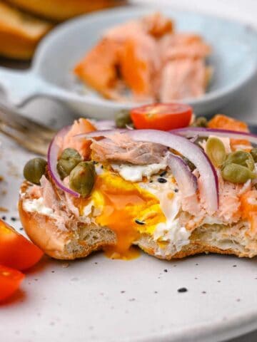smoked salmon and egg toast with capers red onions and cherry tomatoes