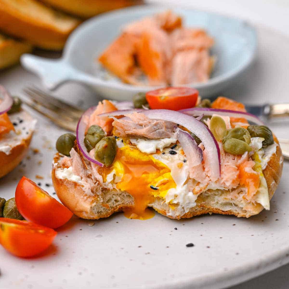 smoked salmon and egg toast with capers red onions and cherry tomatoes