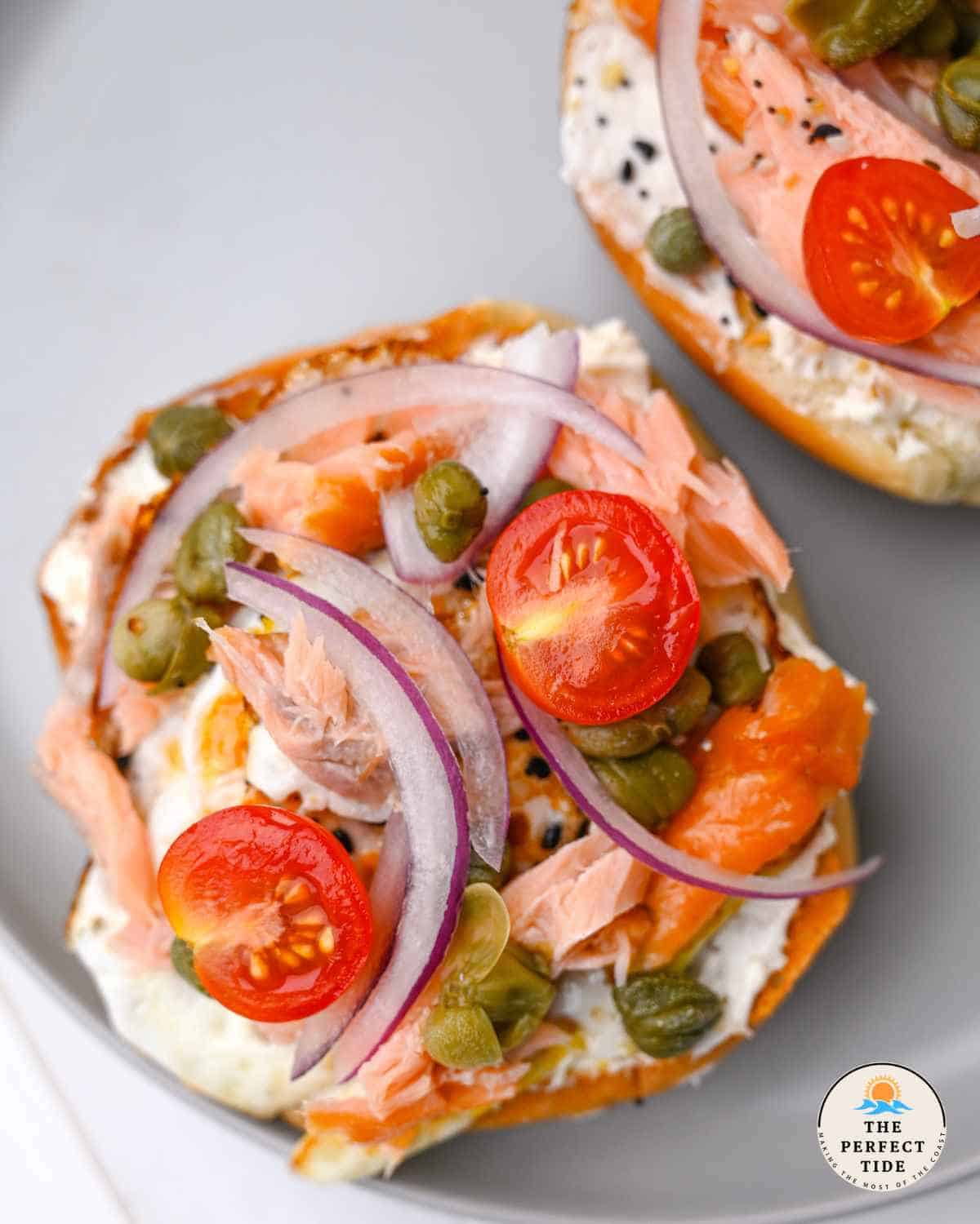 smoked salmon breakfast toast with eggs cherry tomatoes red onion and capers