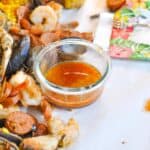 seafood boil sauce next to a boil