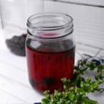 homemade blueberry vodka in a mason jar