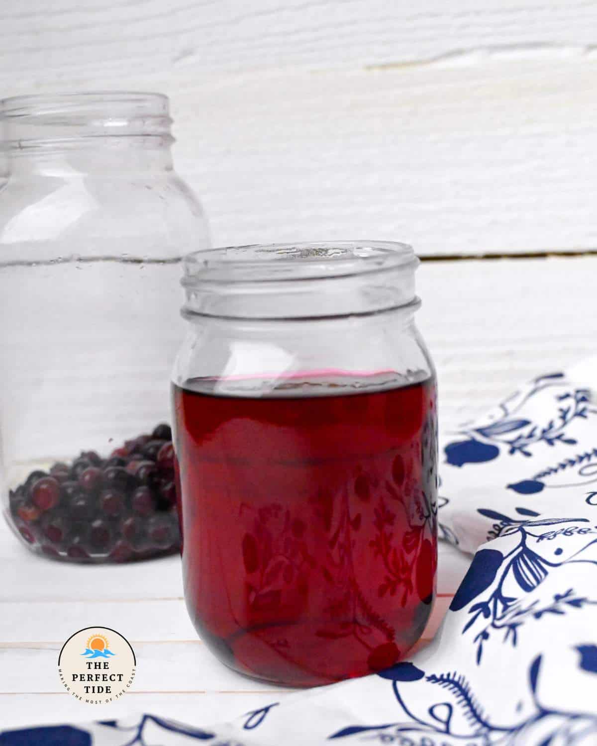 homemade blueberry vodka in a mason jar