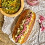 crab roll sandwich with chimichurri and pickled onions