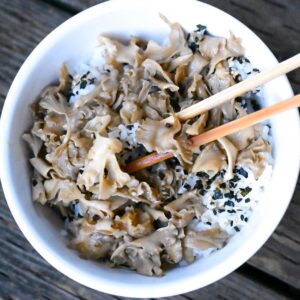 sauteed cauliflower mushrooms in rice bowl