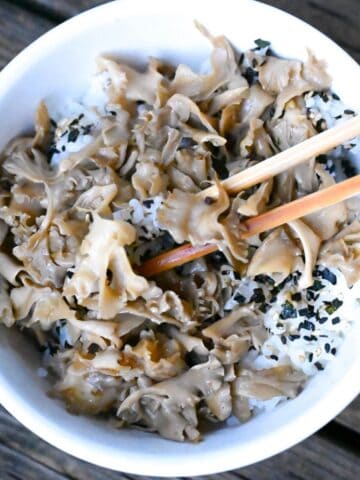 sauteed cauliflower mushrooms in rice bowl