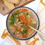 porcini mushroom soup with veggies in a bowl