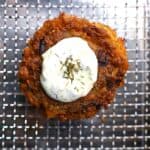 air fryer frozen crab cakes on basket with tartar sauce