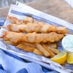 crispy fried razor clam recipe in a razor clam newspaper with fried lemon and tartar sauce