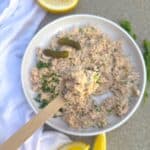canned salmon salad recipe in a white plate with a spoonful